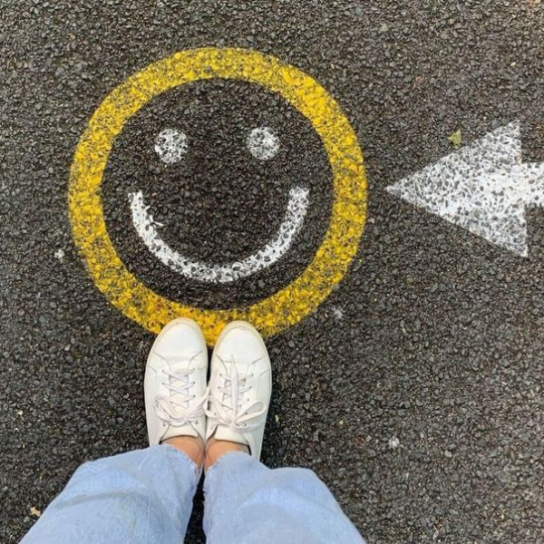 smiley face on the ground and feet